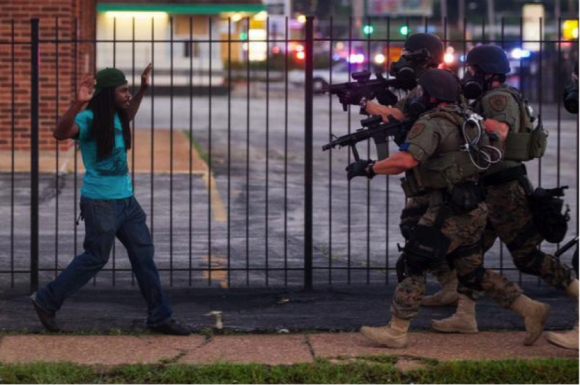 Troops in Ferguson Approaching a Young Man