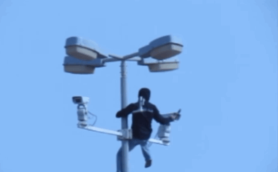Person Destroying Surveillance Camera