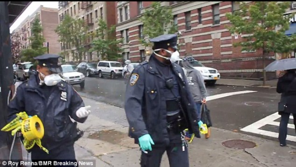 New York City Police Officers Taking Down Ebola Caution Tape