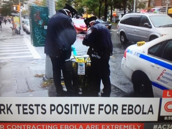 New York City Police Officers Disposing of Ebola Related Materials in Public Trash Can