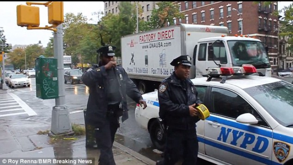 New York City Police Officer Touching His Mouth After Disposing of Ebola Related Materials