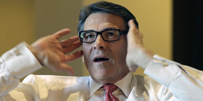 Texas Gov. Rick Perry is seen during an interview at the California Republican Party convention in Anaheim, Calif., Friday, Oct. 4, 2013. Perry compared the business environments of Texas and California, saying that excessive taxation, regulation and other factors were driving companies from California to other states, including Texas. (AP Photo/Reed Saxon)